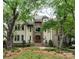 Grand two-story house with stone accents and lush landscaping at 2708 Chilton Pl, Charlotte, NC 28207