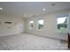 Large bonus room with golf course views and neutral carpeting at 2708 Chilton Pl, Charlotte, NC 28207