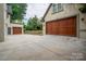 Attached two-car garage with extra parking space at 2708 Chilton Pl, Charlotte, NC 28207