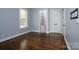 Light-filled bedroom with hardwood floors and ensuite bathroom access at 2708 Chilton Pl, Charlotte, NC 28207