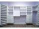 Large walk-in closet with ample shelving and drawers at 2708 Chilton Pl, Charlotte, NC 28207