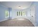 Bright bedroom with bay window and neutral carpeting at 2708 Chilton Pl, Charlotte, NC 28207