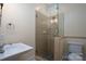 Modern bathroom with glass shower enclosure and neutral tile at 2708 Chilton Pl, Charlotte, NC 28207