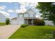 Two-story house with double garage and landscaped lawn at 3040 Gilroy Dr, Indian Land, SC 29707