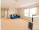 Spacious bonus room with plush sofa and large windows at 3040 Gilroy Dr, Indian Land, SC 29707