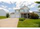 Two-story house with double garage and landscaped lawn at 3040 Gilroy Dr, Indian Land, SC 29707