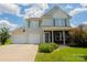 Two-story house with double garage and landscaped lawn at 3040 Gilroy Dr, Indian Land, SC 29707