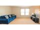 Relaxing living room featuring a comfortable blue sofa at 3040 Gilroy Dr, Indian Land, SC 29707
