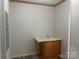 Laundry area with sink and ample storage at 200 Olin Loop, Olin, NC 28660