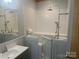 Accessible bathroom with walk-in tub and shower at 200 Olin Loop, Olin, NC 28660