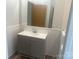 Modern bathroom with gray vanity and updated fixtures at 200 Olin Loop, Olin, NC 28660