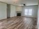 Spacious living room featuring a fireplace and wood-look flooring at 200 Olin Loop, Olin, NC 28660