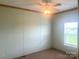 Bedroom with neutral walls, carpet, and a ceiling fan at 200 Olin Loop, Olin, NC 28660