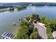 Aerial view of waterfront property with boat docks and parking at 3240 Lake Pointe Dr, Belmont, NC 28012