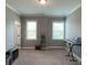 Bright bedroom with two windows and neutral wall color at 2044 Sweet William Dr, Harrisburg, NC 28075