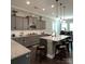 Spacious kitchen with gray cabinets, granite countertops, and island at 2044 Sweet William Dr, Harrisburg, NC 28075