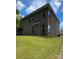 Brick home with a partially visible garage at 2044 Sweet William Dr, Harrisburg, NC 28075
