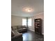 Cozy sitting room featuring a sectional sofa and built-in bookcase at 2044 Sweet William Dr, Harrisburg, NC 28075