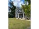 Two-story brick home with a front porch and landscaped lawn at 2044 Sweet William Dr, Harrisburg, NC 28075