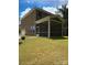 Two-story home with a large screened porch and fire pit at 2044 Sweet William Dr, Harrisburg, NC 28075