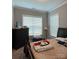 Spacious primary bedroom with two windows and a dresser at 2044 Sweet William Dr, Harrisburg, NC 28075