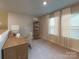 Charming home office featuring built-in shelving and window seating at 2011 Merida St, Charlotte, NC 28214