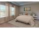 Spacious bedroom with large windows and plush carpeting at 2011 Merida St, Charlotte, NC 28214