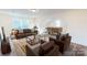 Game room with brown leather seating, a coffee table, and a custom bar at 2105 Clifton Rd, Sherrills Ford, NC 28673