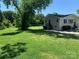 Spacious backyard with a shed and mature trees at 9416 Sandburg Ave, Charlotte, NC 28213