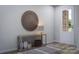 Bright entryway with a circular wall hanging and console table at 1008 Briar Well St, Mint Hill, NC 28227