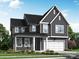 Two-story home with gray siding and white garage door at 1008 Briar Well St, Mint Hill, NC 28227