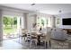 Open concept dining room with sliding glass doors leading to backyard at 1008 Briar Well St, Mint Hill, NC 28227