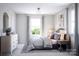 Bright bedroom with a queen-size bed and dresser at 1008 Briar Well St, Mint Hill, NC 28227