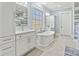 Spa-like bathroom with a freestanding tub and dual vanities at 001 Beatties Ford Rd, Huntersville, NC 28078