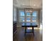 Bright dining room with hardwood floors and large windows offering water views at 001 Beatties Ford Rd, Huntersville, NC 28078