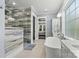 Bathroom with walk-in shower and modern finishes at 001 Beatties Ford Rd, Huntersville, NC 28078