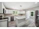 Modern kitchen with white cabinets, granite counters, and island at 2120 Old Salisbury Concord Rd, Concord, NC 28025