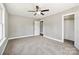 Bedroom with closet, window, and ceiling fan at 2120 Old Salisbury Concord Rd, Concord, NC 28025