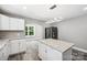 Modern kitchen with white cabinets, granite counters, and island at 2120 Old Salisbury Concord Rd, Concord, NC 28025