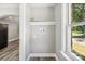 Bright laundry area with window and built-in shelving at 2120 Old Salisbury Concord Rd, Concord, NC 28025