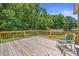 Deck overlooking a wooded backyard with a chair at 2120 Old Salisbury Concord Rd, Concord, NC 28025