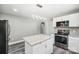 Modern kitchen with white cabinets, granite counters, and island at 2120 Old Salisbury Concord Rd, Concord, NC 28025