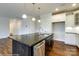 Modern kitchen with white cabinets, granite island, and stainless steel dishwasher at 1465 Ardmore Dr # 237, Sherrills Ford, NC 28673