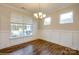 Bright dining room with hardwood floors, wainscoting, and large window at 1465 Ardmore Dr # 237, Sherrills Ford, NC 28673