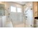 Large walk-in shower with tiled walls and built-in seat at 1465 Ardmore Dr # 237, Sherrills Ford, NC 28673