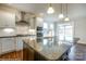 Modern kitchen with dark cabinetry, granite island, and stainless steel appliances at 1465 Ardmore Dr # 237, Sherrills Ford, NC 28673
