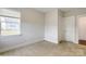 Well-lit bedroom featuring carpet, a window, and a closet at 1465 Ardmore Dr # 237, Sherrills Ford, NC 28673