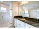 Bathroom with granite countertop, white cabinets, and a glass shower at 1465 Ardmore Dr # 237, Sherrills Ford, NC 28673
