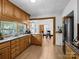 Open kitchen with wood cabinets, stainless steel appliances, and a dining area view at 2491 Highway 274 Hwy, Cherryville, NC 28021