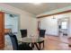 Bright dining area with glass table and four chairs, open to adjacent rooms at 2491 Highway 274 Hwy, Cherryville, NC 28021